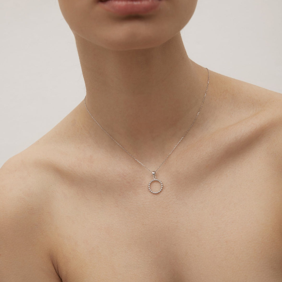 White gold ring-shaped pendant